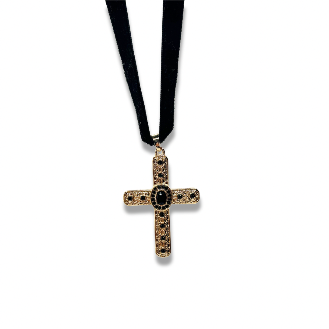 a black velvet choker with a gold cross pendant adorned with black gems