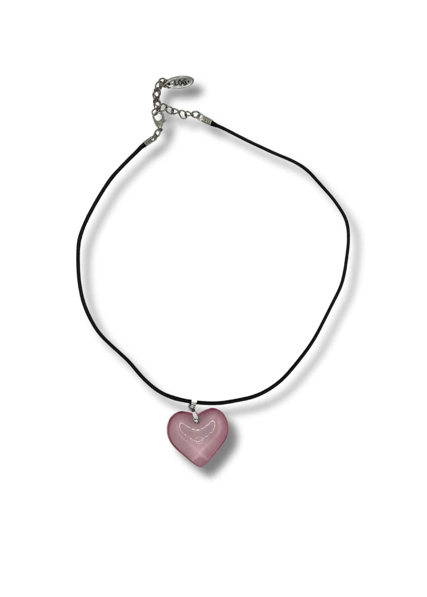 A pink glass heart pendant with stainless steel silver hardware on a leather cord chain
