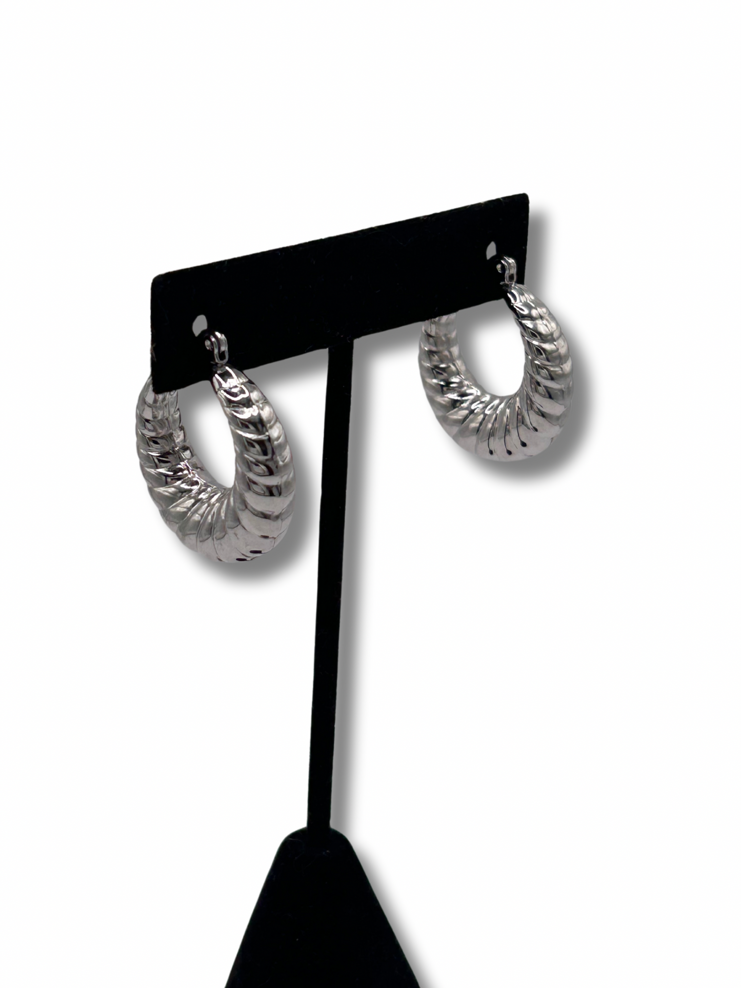 A pair of silver twisted creole hoop earrings