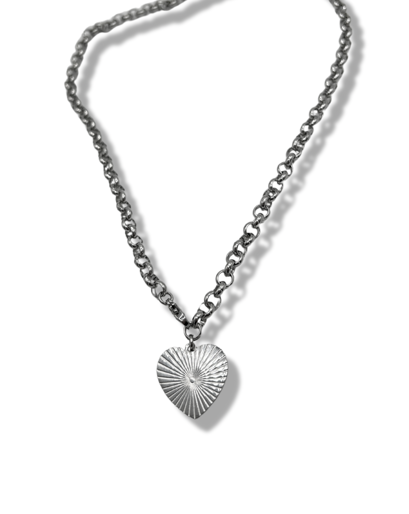 a chunky heart pendant chain, on the heart pendant is a rising sun design. the metal is stainless steel