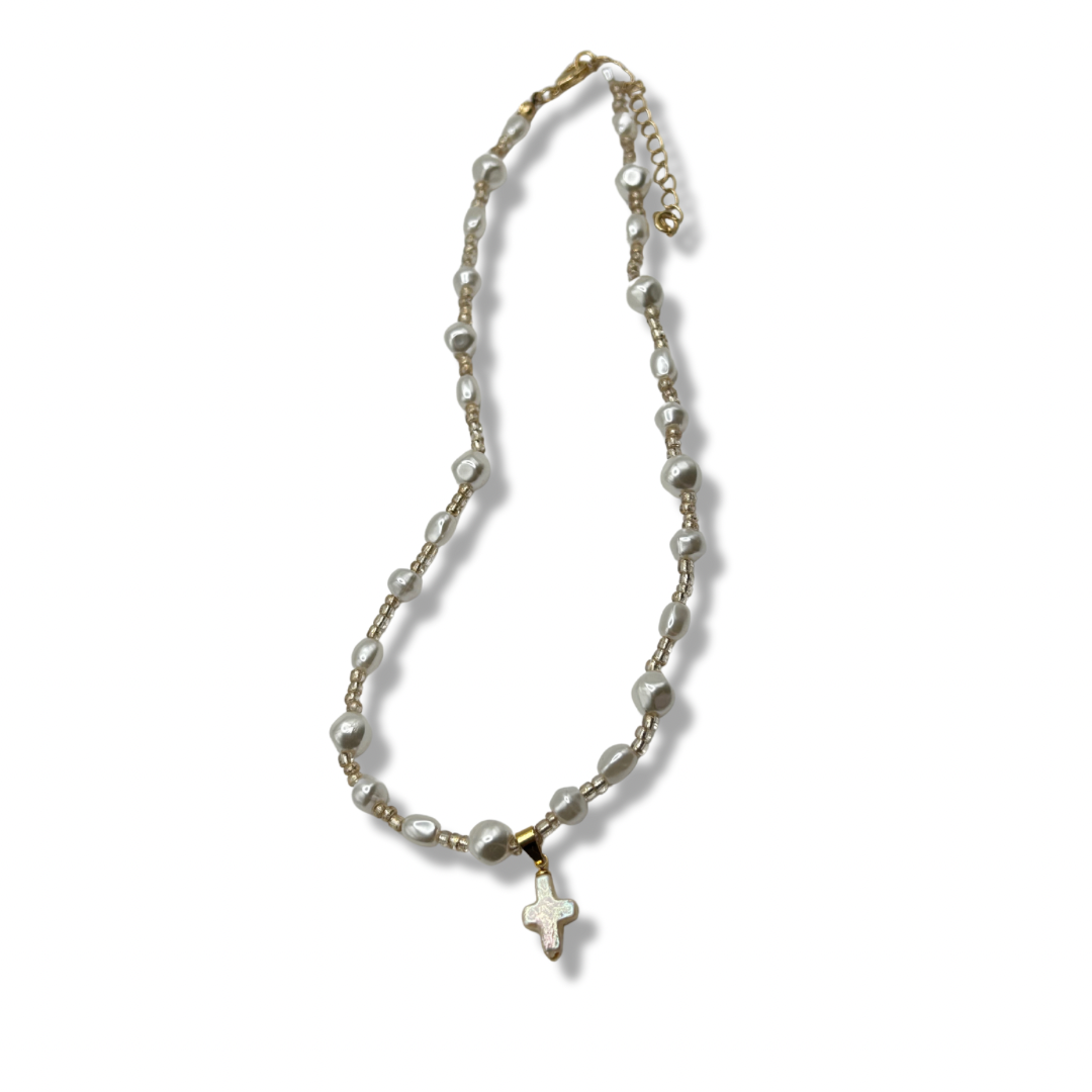 a freshwater pearl gold rosary necklace with a pearl cross pendant