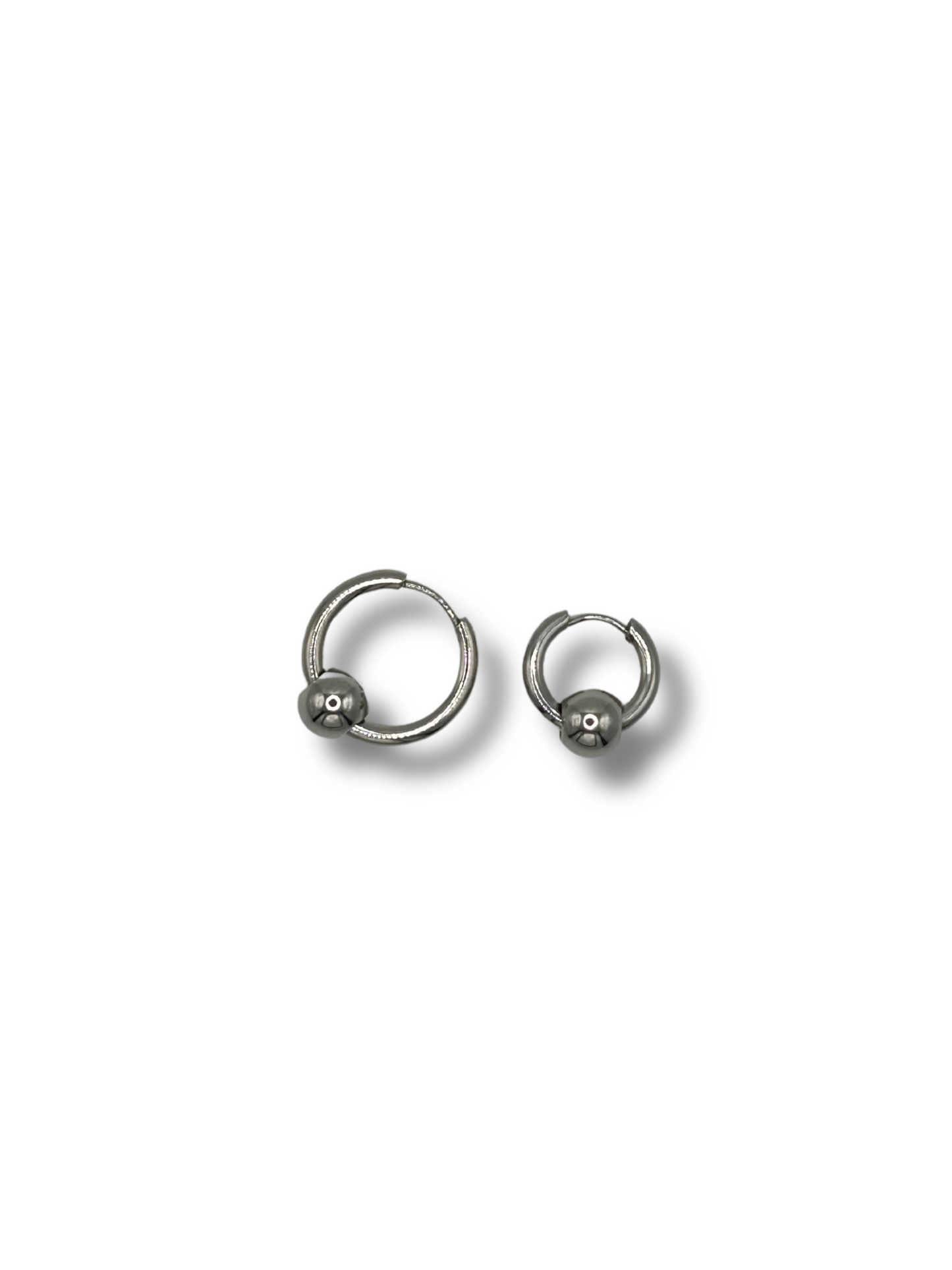 2 earrings in different sizes, one is larger and they both are circular and feature a metallic infinity ball piercing style