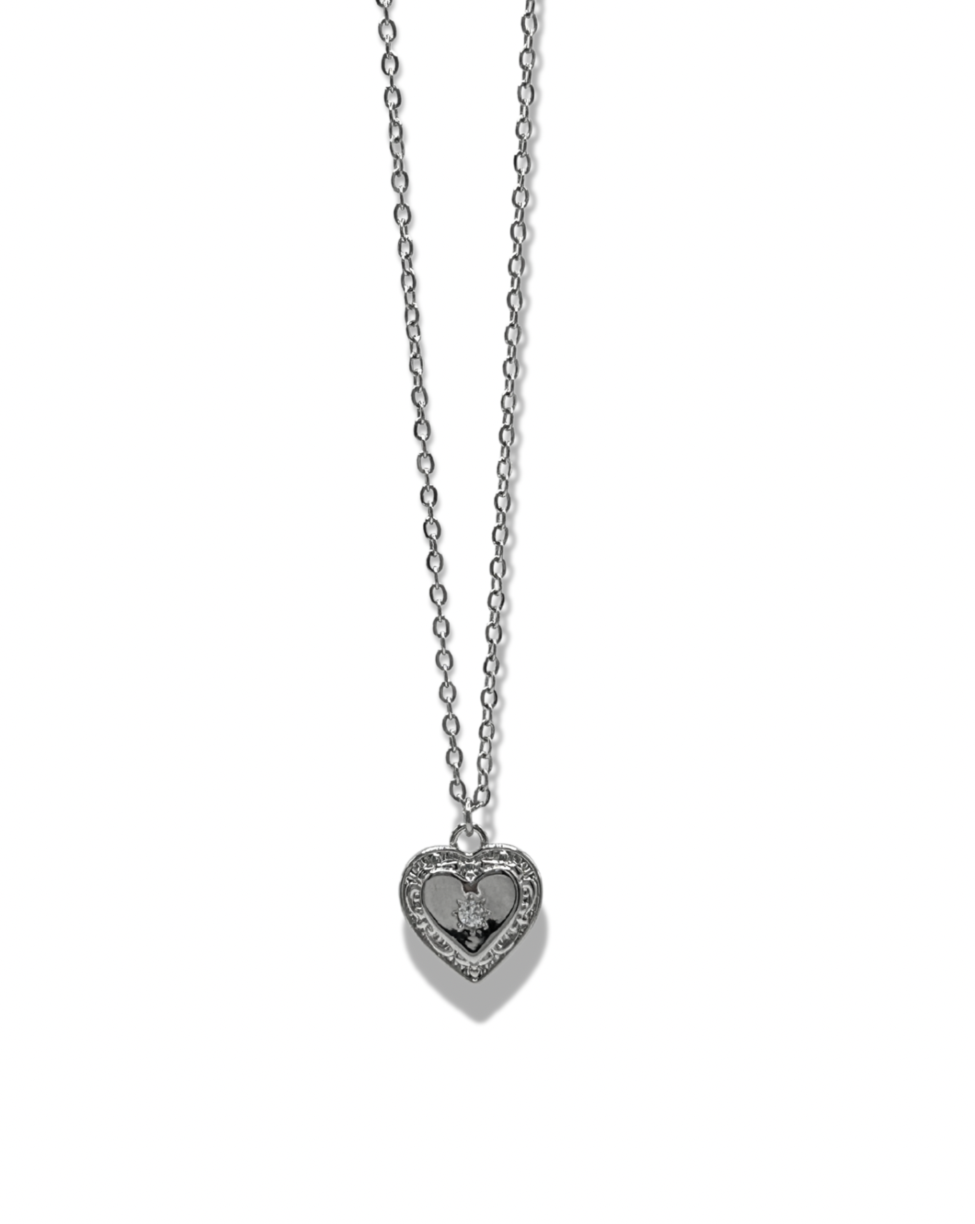 a dainty rhinestone star engraved heart pendant