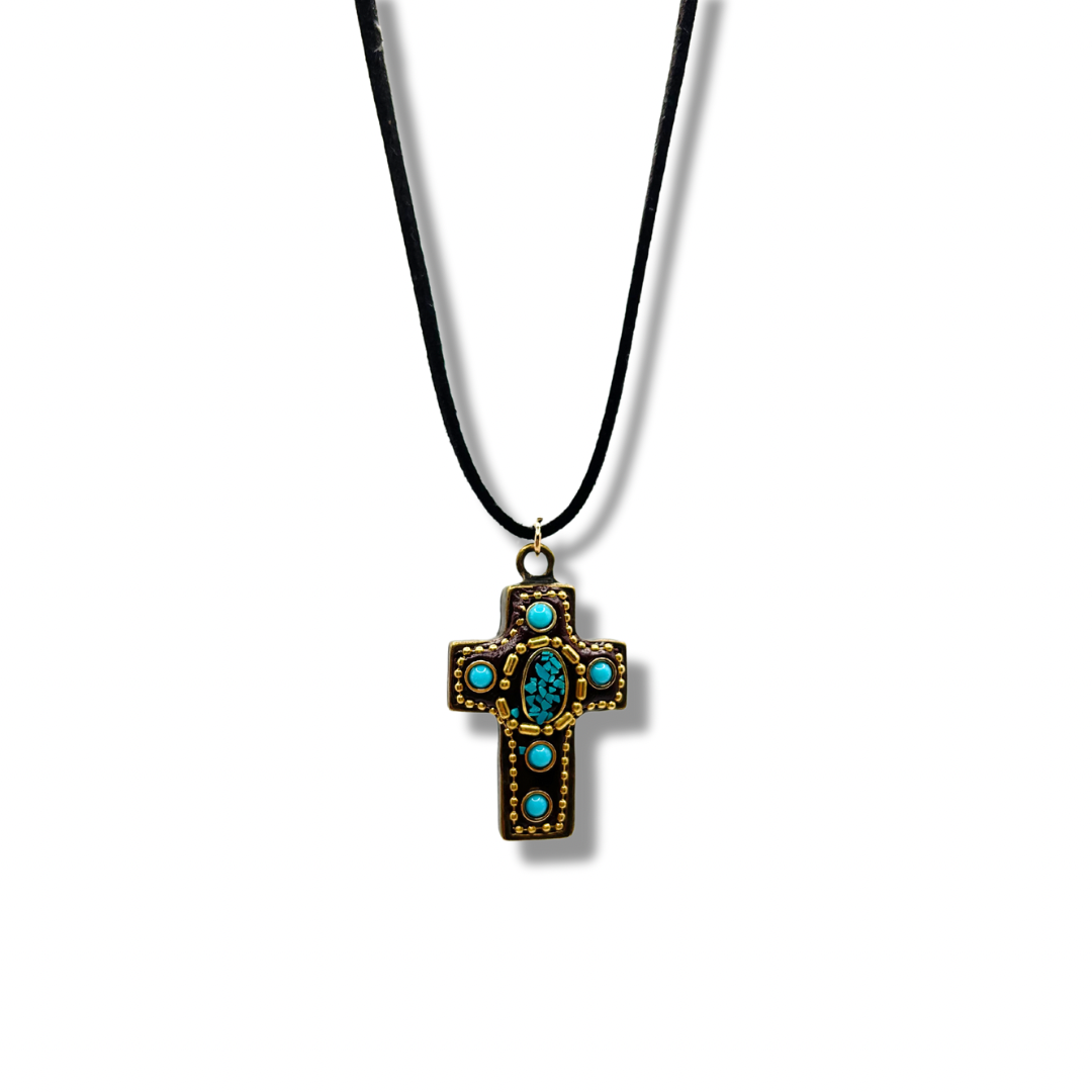a gold and turquoise vintage-inspired cross pendant on a black cord chain