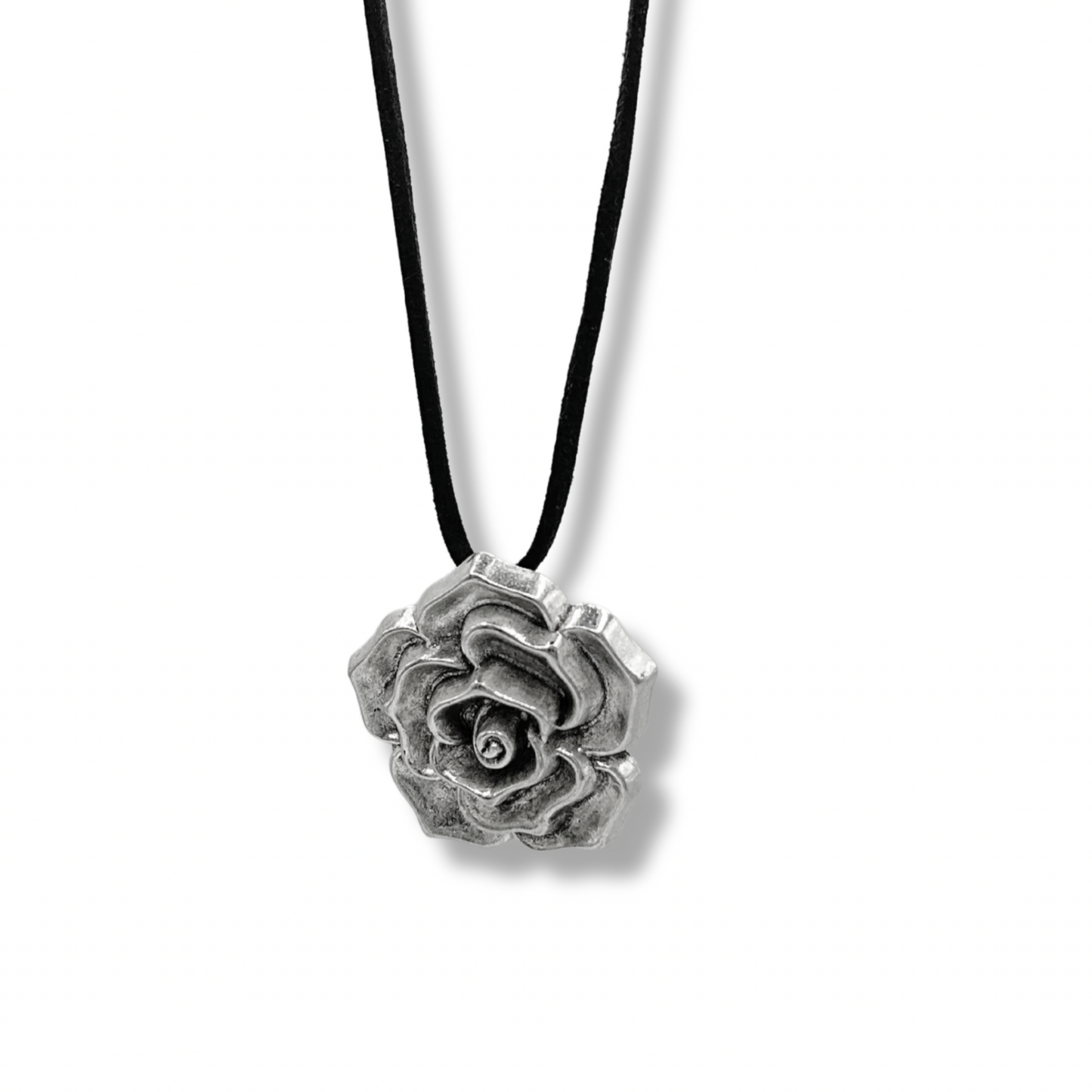 a chunky silver rose head necklace on a suede black cord chain