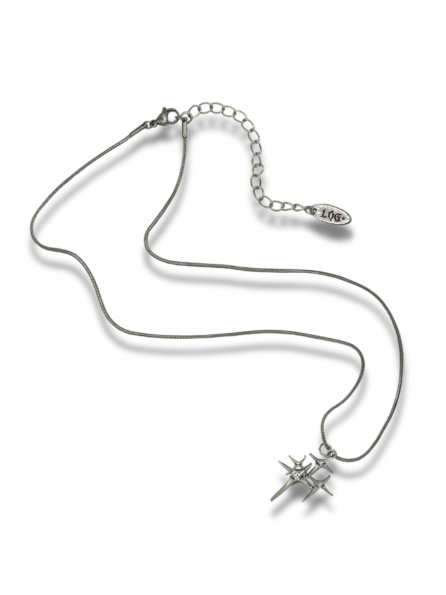 The stargirl necklace. A silver chain necklace with the twinkling star pendant on it. It features a large sparkle surrounded by 3 smaller sparkles.