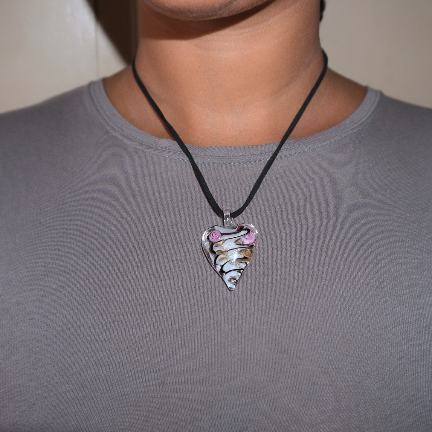Model wearing a love heart floral blown glass necklace