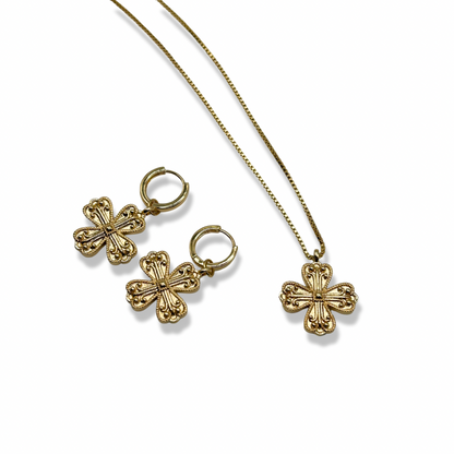 a matching set of jewellery with cross/clover gold earrings and a necklace