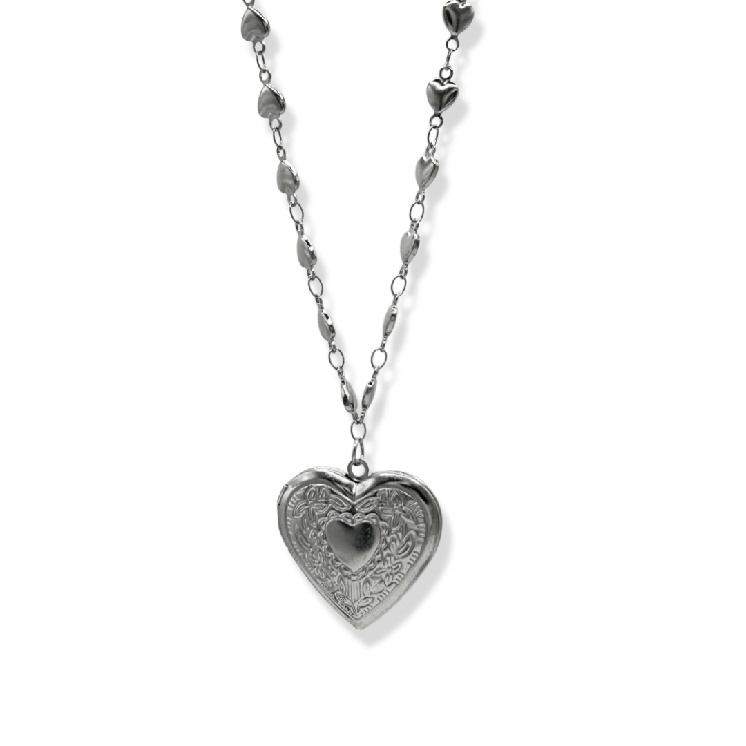 Vintage heart necklace on white background