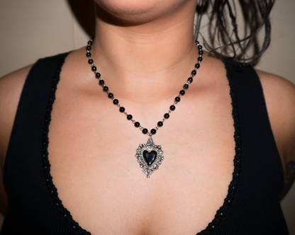 Vintage necklace hanging on close up shot of models neck